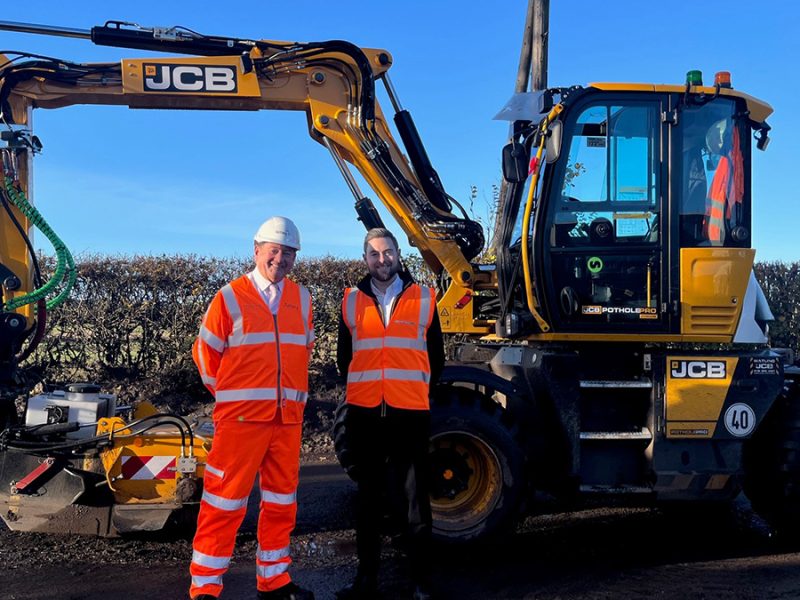 Cllr Mark Deaville with Ben Rawding, from JCB, with the Pothole Pro machinery
